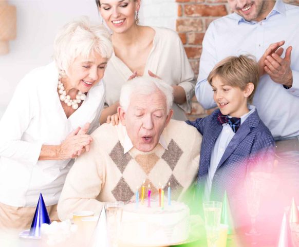 grandpa-blowing-out-candles-on-birthday-cake-2024-10-19-20-13-16-utc (1)